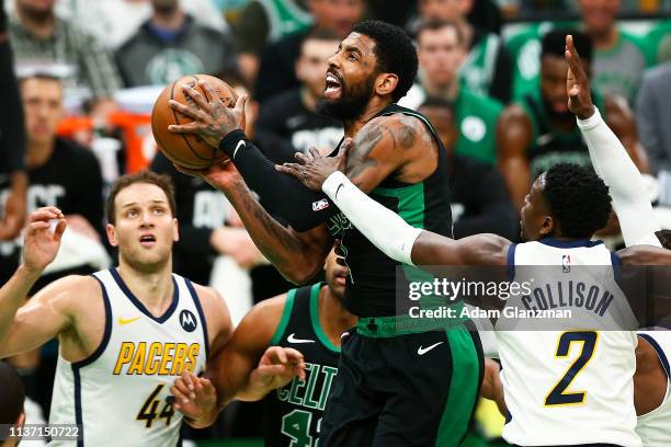 Kyrie Irving of the Boston Celtics drives to the basket past Darren Collison of the Indiana Pacers during Game One of the first round of the 2019 NBA...