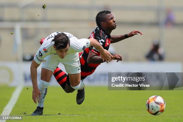 Miler Bolaños of Tijuana struggles for the ball with Alan Mozo of Pumas during the 14th round match between Pumas UNAM and Tijuana as part of the...