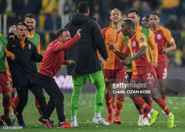 Galatasaray's Nigerian forward Henry Onyekuru celebrates with his team mates after scoring a goal during the Turkish Super league football match...