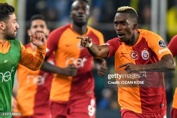 Galatasaray's Nigerian forward Henry Onyekuru celebrates with his team mates after scoring a goal during the Turkish Super league football match...