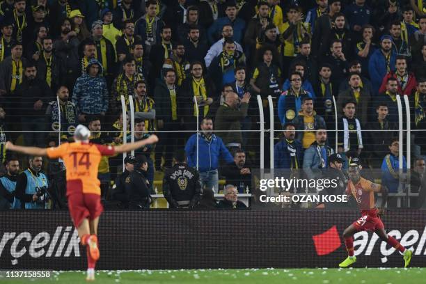 Galatasaray's Nigerian forward Henry Onyekuru celebrates with his team mates after scoring a goal during the Turkish Super league football match...