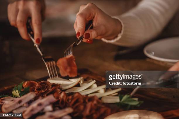 delicatessen and cheese served on the table - serrano ham stock pictures, royalty-free photos & images