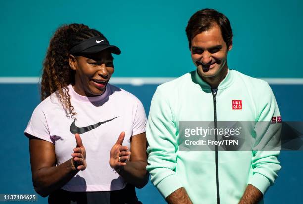 Serena Williams of the United States speaks to Roger Federer of Switzerland during the ribbon cutting ceremony on the new Stadium Court at the Hard...