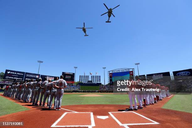 Military flyover takes place during the pre-game ceremony prior to the game between the St. Louis Cardinals and the Cincinnati Reds at Estadio de...