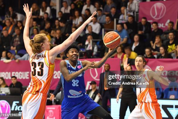 Emma Meesseman of Ekaterinburg defends against Natasha Howard of Kursk with Alba Torrens of Ekaterinburg looking on during the Euro League Women...