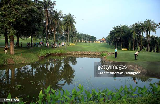 General view of play as Shubhankar Sharma of India putts on the tenth green on Day One of the Maybank Championship at Saujana Golf & Country Club,...