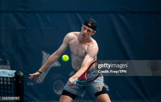 Dennis Shapovalov of Canada with his coach Rob Steckley on the practice courts at the Hard Rock Stadium, before his first match of the Miami Open on...