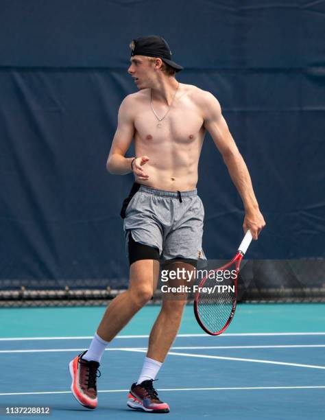 Dennis Shapovalov of Canada with his coach Rob Steckley on the practice courts at the Hard Rock Stadium, before his first match of the Miami Open on...
