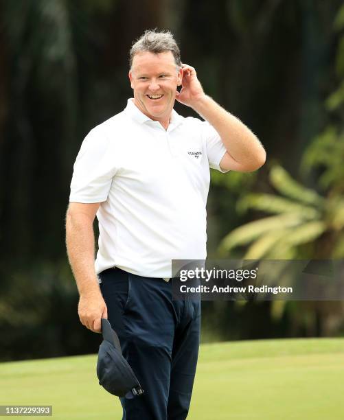 Marcus Fraser of Australia smiles on the ninth hole on Day One of the Maybank Championship at Saujana Golf & Country Club, Palm Course on March 21,...