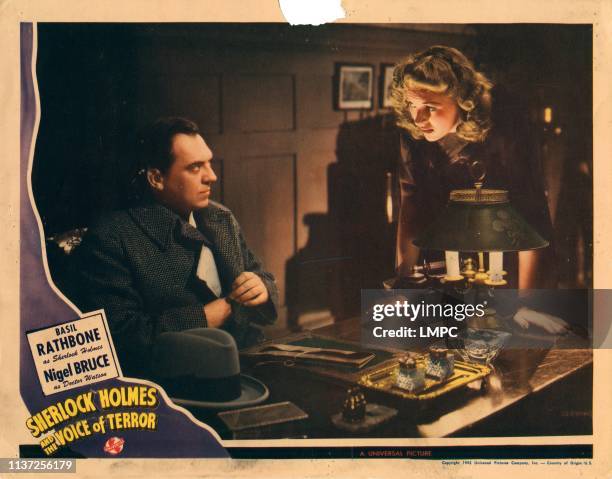 Sherlock Holmes And The Voice Of Terror, lobbycard, from left: Thomas Gomez, Evelyn Ankers, 1942.