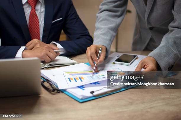 businessmen are analyzing the investment - wealth manager stock pictures, royalty-free photos & images