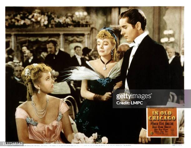 In Old Chicago, lobbycard, from left, Phyllis Brooks, Alice Faye, Tyrone Power, 1937.