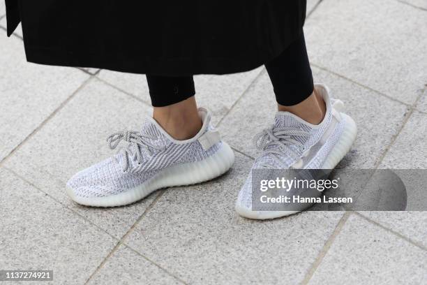 Guest, shoe detail, wearing Yeezy Boost is seen at the Hera Seoul Fashion Week 2019 F/W at Dongdaemun Design Plaza at Dongdaemun Design Plaza on...