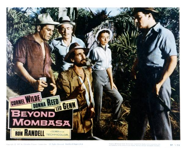 Beyond Mombasa, lobbycard, from left, Ron Randell, Leo Genn , Christopher Lee, Donna Reed, , Cornel Wilde, 1956.