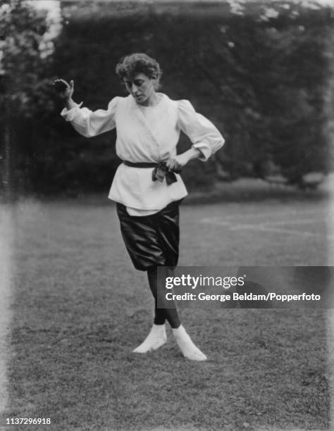 Jujutsu instructor Emily Diana Watts demonstrates a Jujutsu position beside the tennis court in the grounds of Woburn Abbey in Bedfordshire, England...