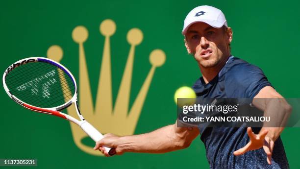 Australia's John Millman plays a forehand return Spain's Roberto Bautista Agut during their tennis match on the day 3 of the Monte-Carlo ATP Masters...