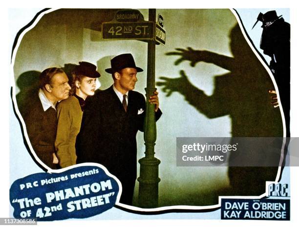 The Phantom Of 42nd Street, lobbycard, from left, Alan Mowbray, Kay Aldridge, Dave O'Brien, 1945.