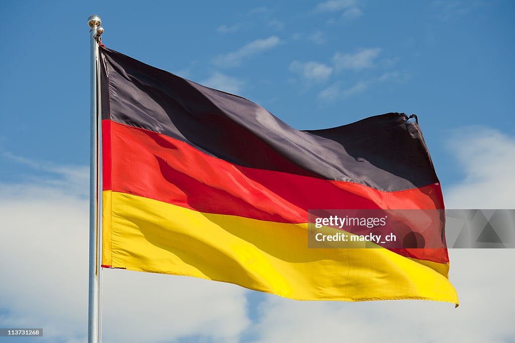 Flag of Germany flying on top of flag pole