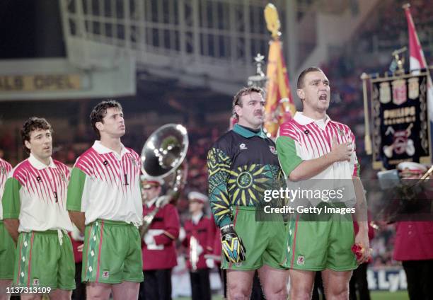 Wales captain Vinnie Jones is joined by Dean Saunders Gary Speed and Neville Southall in singing the national anthem before the World Cup Qualifier...