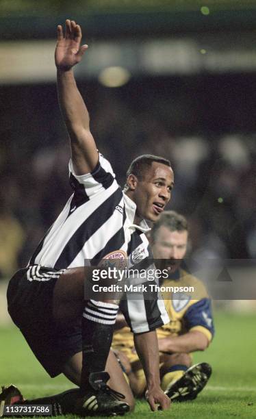 Newcastle United striker Les Ferdinand celebrates one of his two goals as Spurs defender Colin Calderwood looks on during Newcastle's 7-1 Premier...