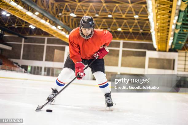 hockey - hockey player on ice stock pictures, royalty-free photos & images