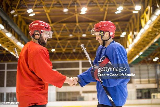 good sportsmanship - hockey helmet stock pictures, royalty-free photos & images