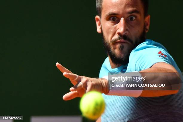 Bosnia Herzegovina's Damir Dzumhur plays a forehand return to Italy's Marco Cecchinato during their tennis match on the day 3 of the Monte-Carlo ATP...