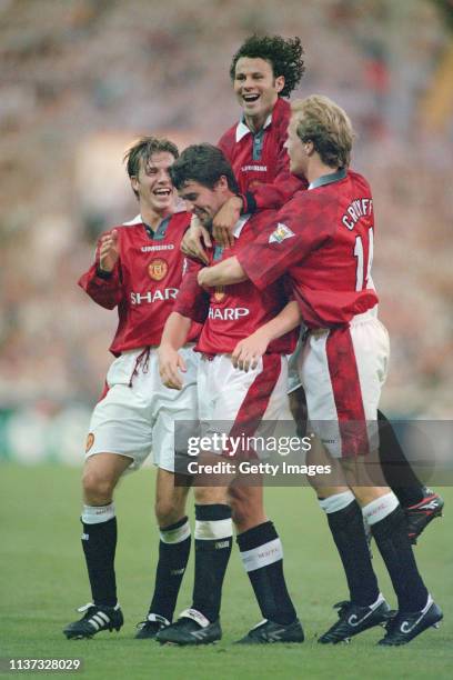 Manchester United player Roy Keane is congratulated by David Beckham Ryan Giggs and Jordi Cruyff after scoring in the 4-0 FA Charity Shield victory...