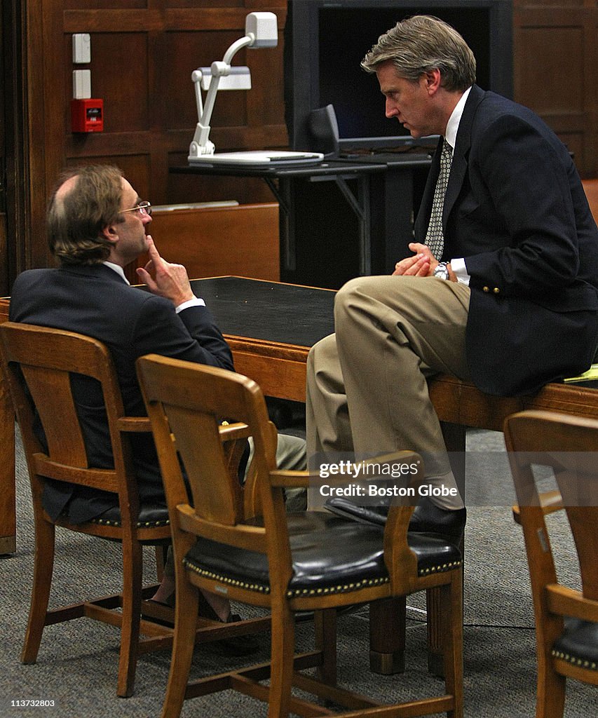 Defence attorney, Tim Bradl talks with Clark Rockefeller at the end ...