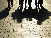 People silhouettes and shadows on the street