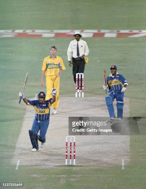 Sri Lanka captain Arunja Ranatunga celebrates with Aravinda De Silva as Australia bowler Glen McGrath looks on as Sri Lanka win the 1996 ICC Cricket...