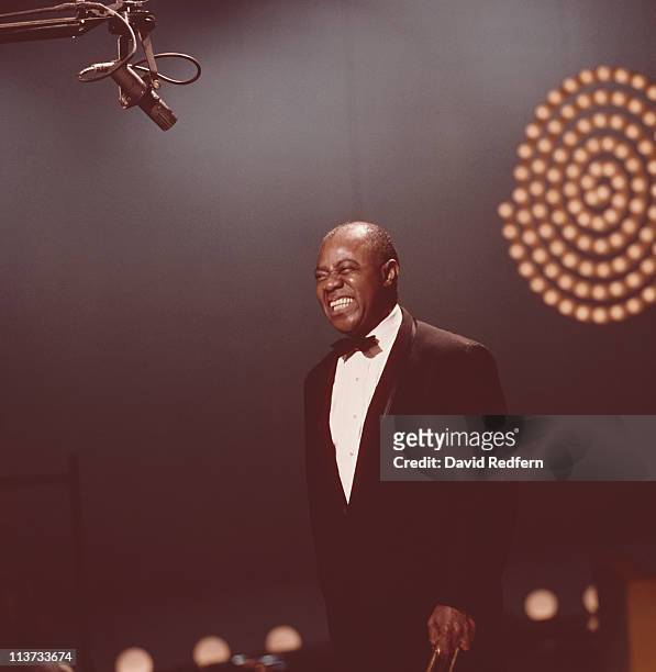 Louis Armstrong , U.S. Jazz singer and trumpeter, appearing on the 'Kraft Music Hall' television show, filmed at the NBC studios in New York City,...