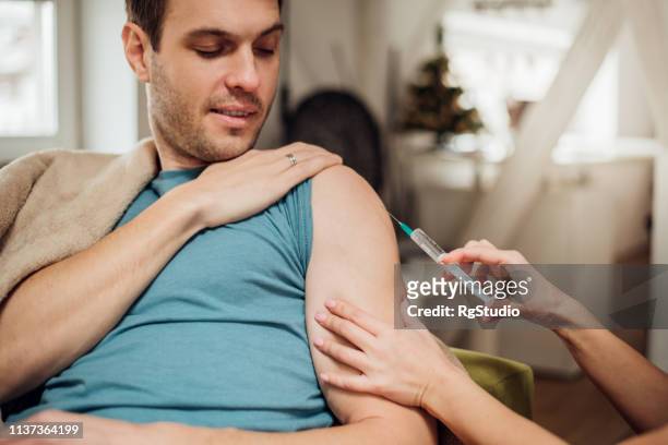 man having vaccine - man studio shot stock pictures, royalty-free photos & images