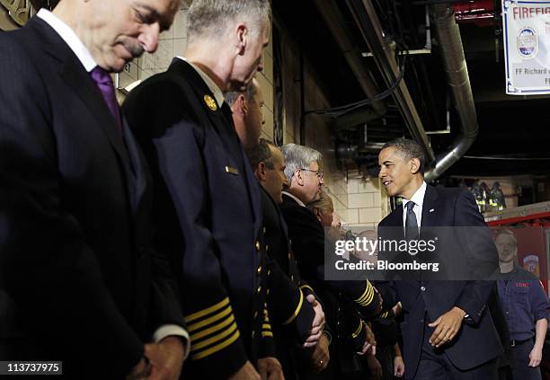 President Barack Obama visits firefighters at the headquarters of Engine Company 54, Ladder Company 4 and Battalion 9, in New York, U.S., on...