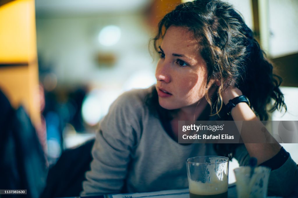 Concerned woman in coffee shop