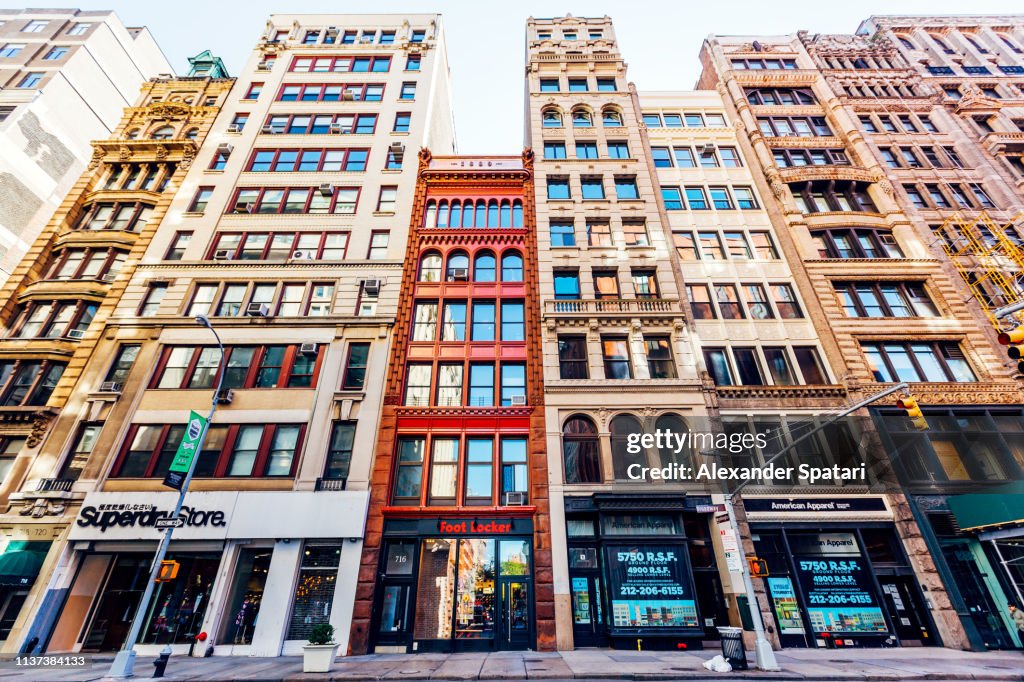Low angle view of residential houses and shops in Tribeca, New York City, USA