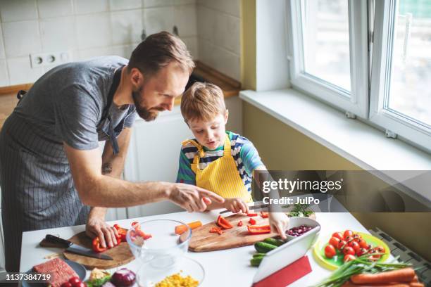 father and son preparing food - kids cooking stock pictures, royalty-free photos & images