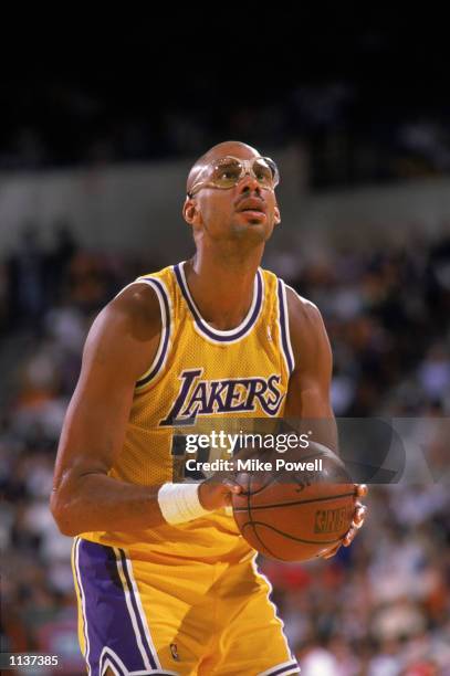 Kareem Abdul-Jabbar of the Los Angeles Lakers shoots a free throw during an NBA game at the Great Western Forum in Los Angeles, California in 1987.