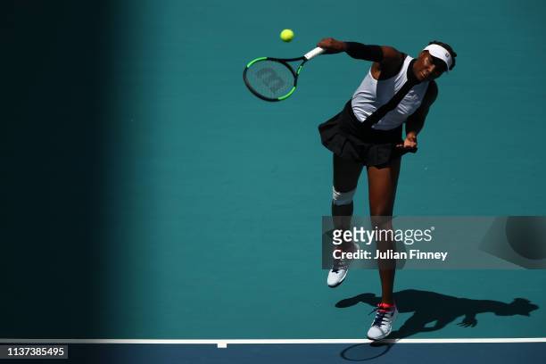Venus Williams of USA serves to Dalila Jakupovic of Slovenia during day four of the Miami Open tennis on March 21, 2019 in Miami Gardens, Florida.