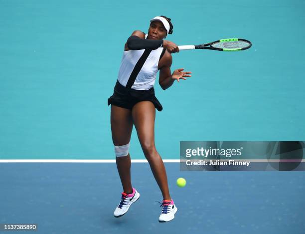 Venus Williams of USA in action against Dalila Jakupovic of Slovenia during day four of the Miami Open tennis on March 21, 2019 in Miami Gardens,...