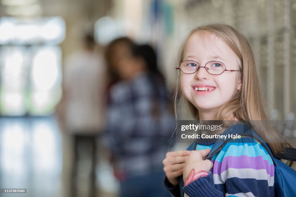 Beautiful Junior High School Student With Down Syndrome Smiles On Her