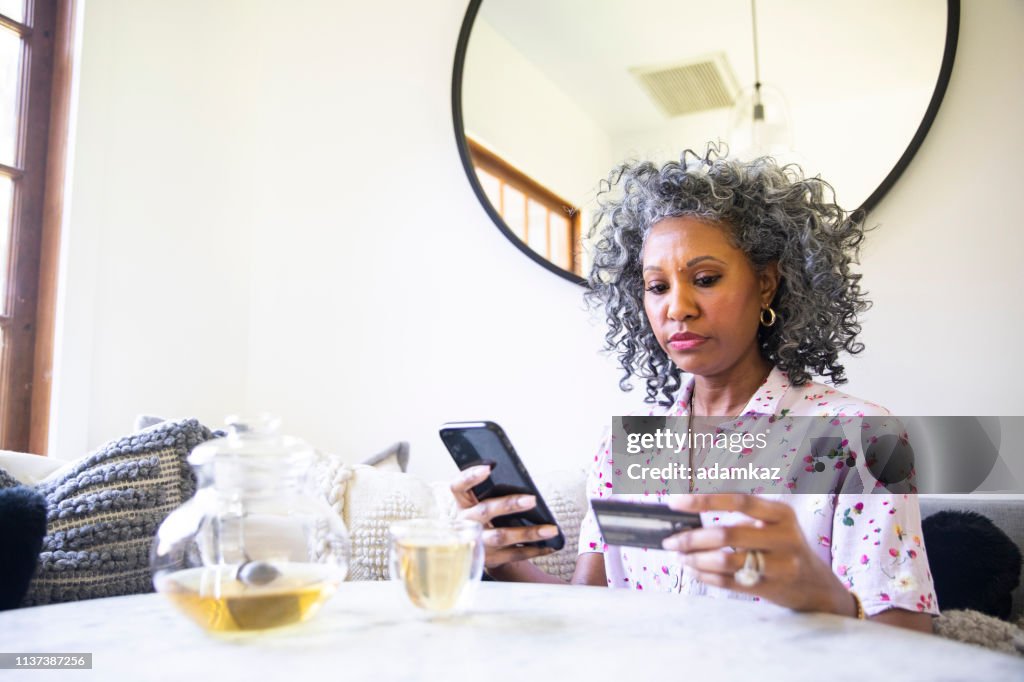 Black Woman Online Shopping on her Phone