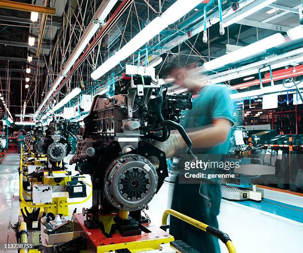 worker manufacturing car engine - car industry stock pictures, royalty-free photos & images