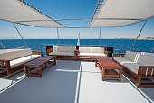 Table and chairs on deck of a luxury motor yacht