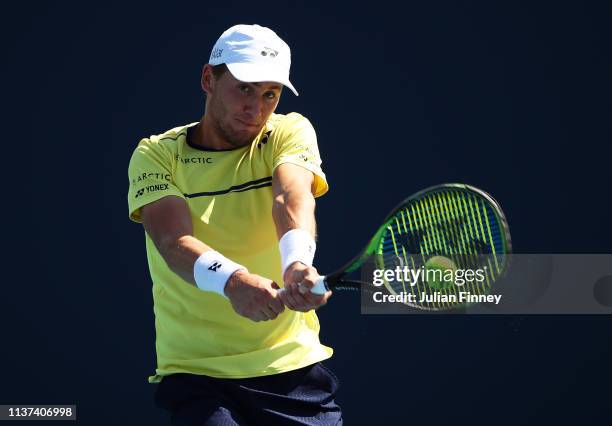 Casper Ruud of Norway in action against Felix Auger-Aliassime of Canada during day four of the Miami Open tennis on March 21, 2019 in Miami Gardens,...