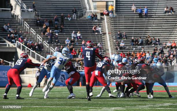 Jordan Sterns of the Salt Lake Stallions pressures Ryan Winslow of the Memphis Express as he gets a punt off during their Alliance of American...