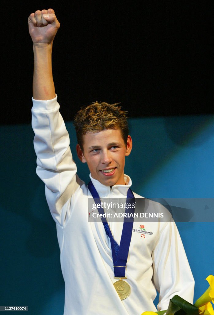 Darren Barker Of England On The Podium With His Gold Medal After darren-barker-of-england-on-the-podium-with-his-gold-medal-after