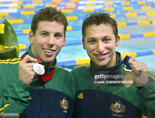 Australian gold medalist Ian Thorpe poses next to compatriot Grant Hackett after the 200m freestyle race during the 2002 Manchester Commonwealth...