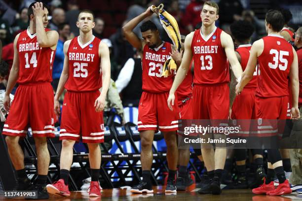 Peter Hanley, Nate Kennell, Dwayne Lautier-Ogunleye, Luuk van Bree, and Jayden Hodgson of the Bradley Braves react after losing in the First Round of...