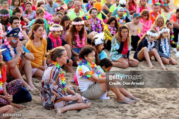 People share a moment of quiet reflection at Bondi Beach on March 22, 2019 in Sydney, Australia. Surfers gather to celebrate five years of OneWave, a...